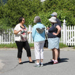 2016 Intern Sarah LaVenture leads a walking tour on the town common.