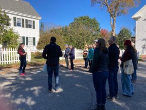 Group of people standing on a street in Castine during a walking tour